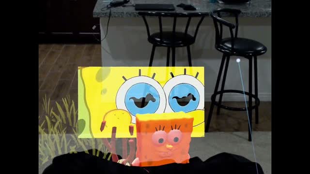 Augmented-reality SpongeBob character in a kitchen.